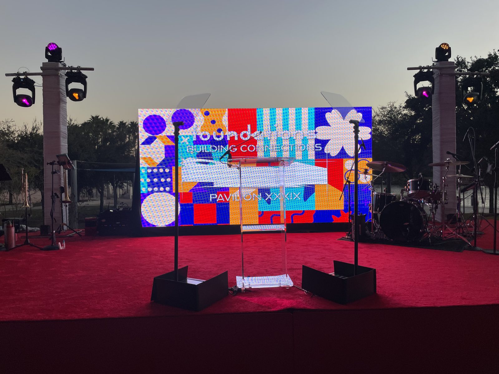 Presidential teleprompter at an outdoor LED-wall stage at dusk